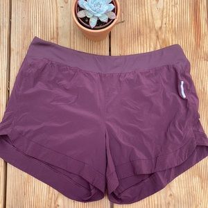 REI women’s athletic shorts. Size L. Maroon color.